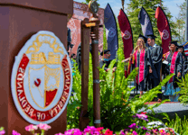 University of Redlands graduates walking by during the commencement ceremony.